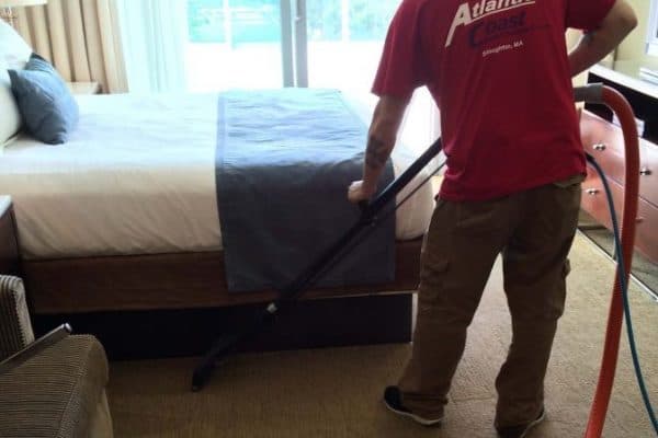 Professional carpet cleaning machine in hotel hallway